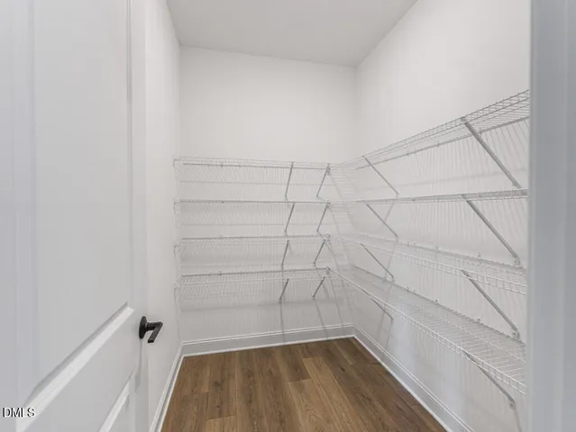 a hallway with wooden floor