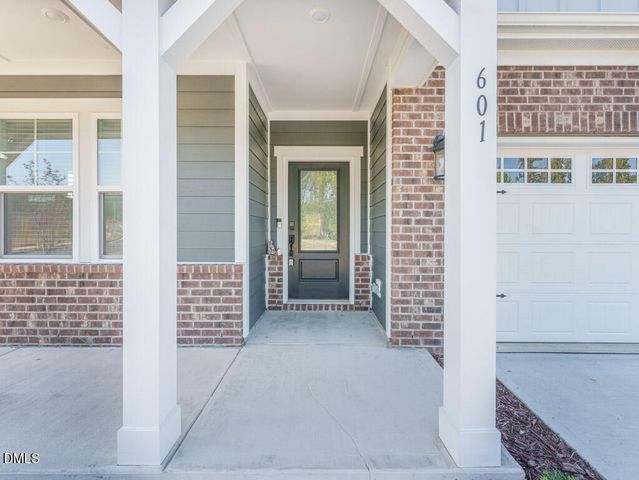 an aerial view of a house with outdoor space