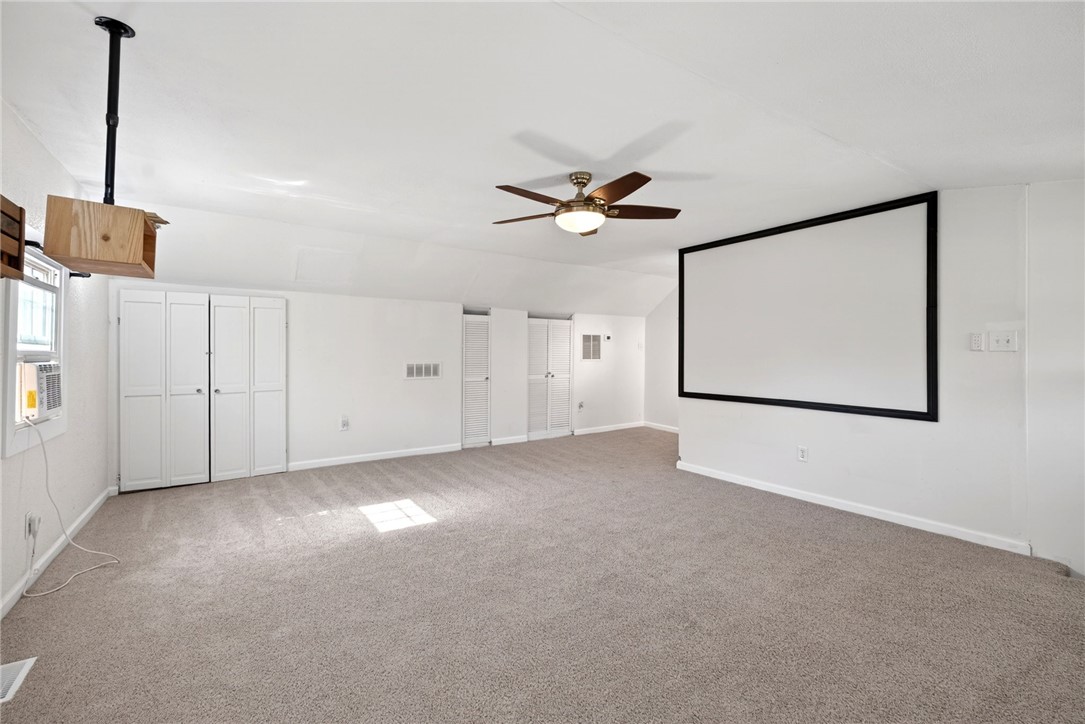 2684 Arthur Road Springfield, OH 45502 - Photo 9 of 69 This spacious room features ample storage and a built-in projector screen, perfect for movie nights.
