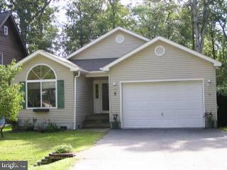 5 Watertown Road Ocean Pines, MD 21811 - Photo 1 of 10 a front view of a house with a yard
