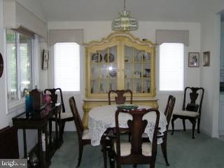 5 Watertown Road Ocean Pines, MD 21811 - Photo 4 of 10 a view of a dining room with furniture and chandelier