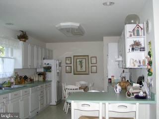 5 Watertown Road Ocean Pines, MD 21811 - Photo 5 of 10 a kitchen with stainless steel appliances granite countertop a sink and cabinets
