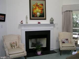 5 Watertown Road Ocean Pines, MD 21811 - Photo 6 of 10 a living room with furniture and a fireplace