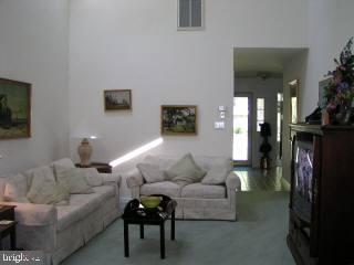 5 Watertown Road Ocean Pines, MD 21811 - Photo 8 of 10 a living room with furniture and a flat screen tv