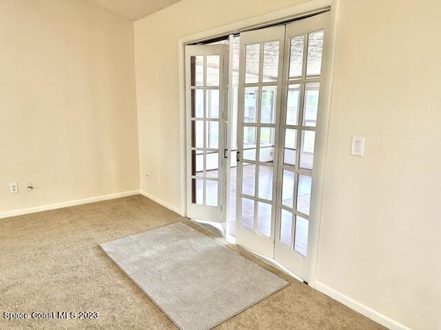1040 Wing Road Southwest Palm Bay, FL 32908 - Photo 20 of 52 a view of an empty room with wooden floor and a window