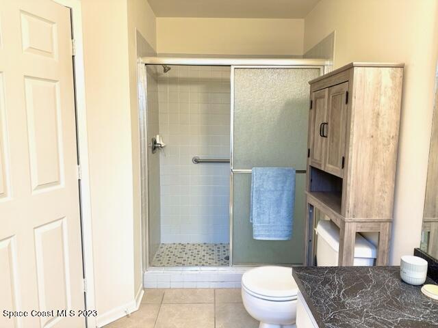 1040 Wing Road Southwest Palm Bay, FL 32908 - Photo 31 of 52 a bathroom with a granite countertop sink toilet and shower
