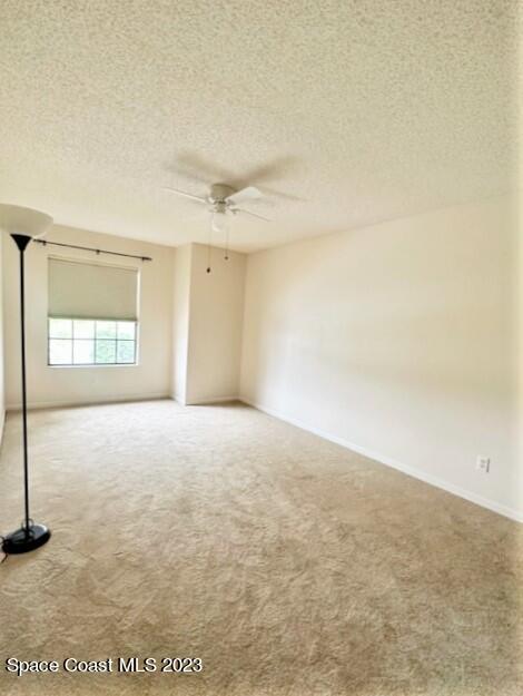 1040 Wing Road Southwest Palm Bay, FL 32908 - Photo 37 of 52 an empty room with a empty space and windows