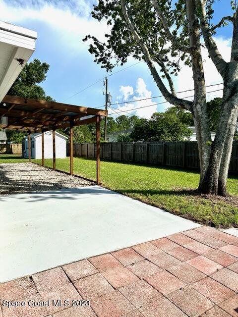 1040 Wing Road Southwest Palm Bay, FL 32908 - Photo 45 of 52 a view of a house with backyard and tree