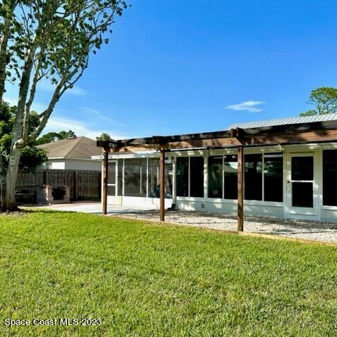 1040 Wing Road Southwest Palm Bay, FL 32908 - Photo 47 of 52 a view of a house with a yard porch and sitting area
