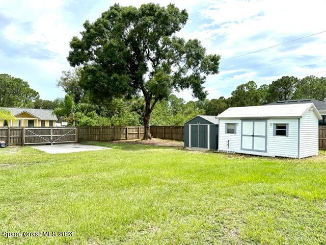 1040 Wing Road Southwest Palm Bay, FL 32908 - Photo 49 of 52 a view of a house with a yard and sitting area