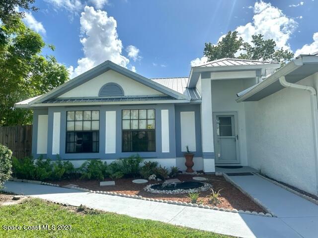 1040 Wing Road Southwest Palm Bay, FL 32908 - Photo 51 of 52 a front view of a house with garden