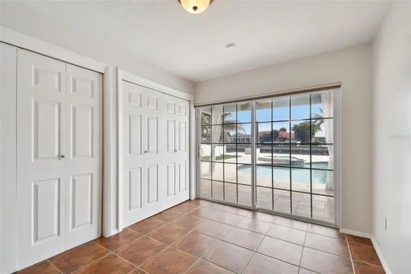 an empty room with windows and entrance