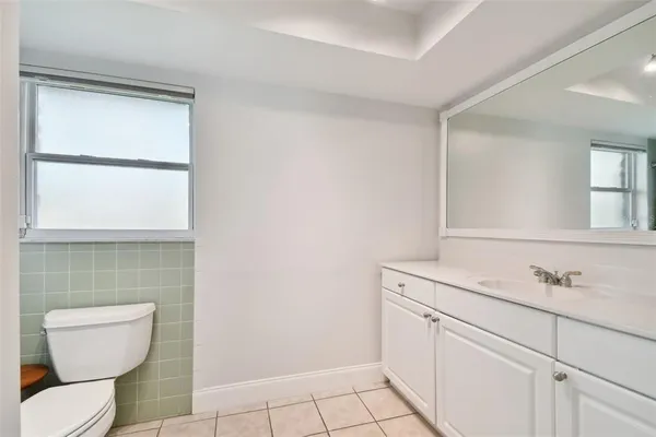 a view of a livingroom with furniture and a flat screen tv