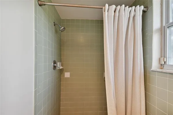 a view of a big room with closet and windows