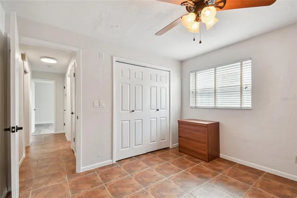 an aerial view of a house with outdoor space and lake view in back