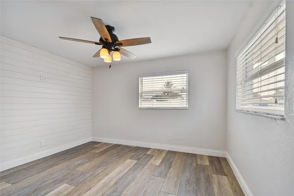 a front view of a house with a garden and yard