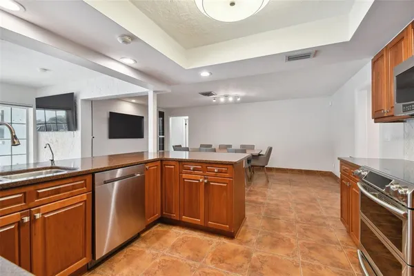 a view of a hallway with a furniture and a refrigerator