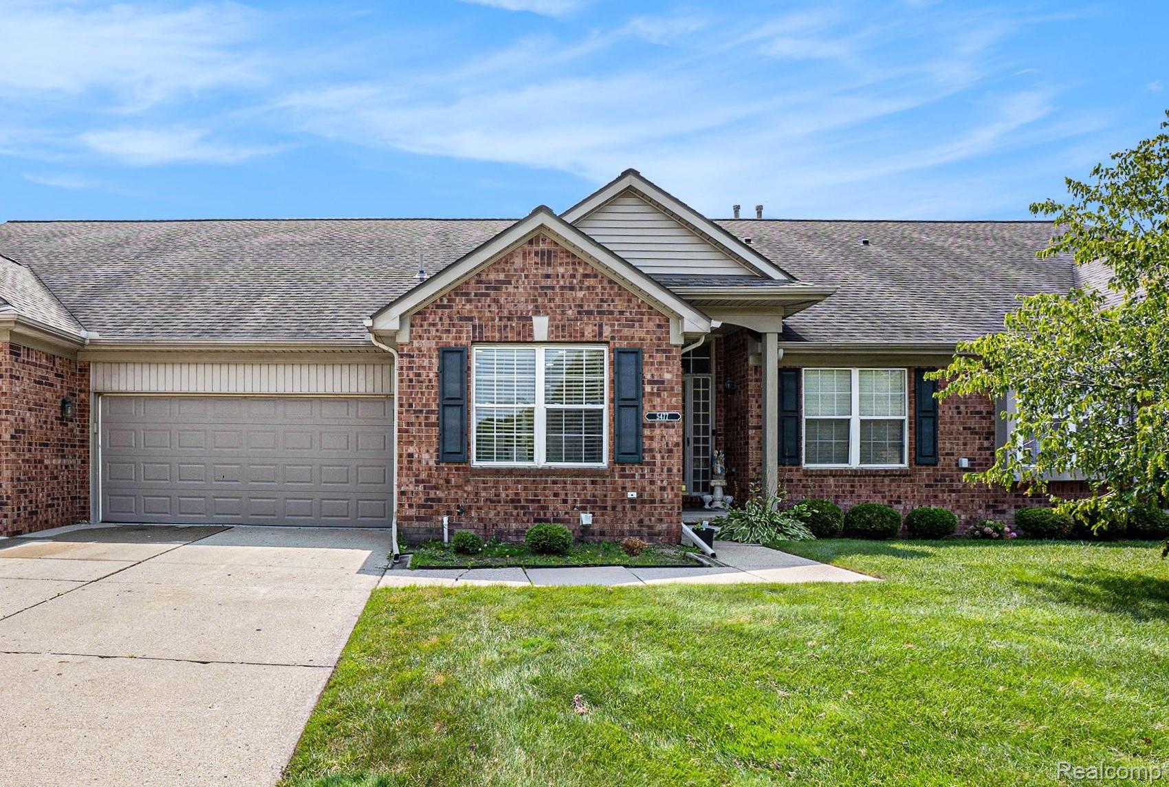 5477 Victory Circle Sterling Heights, MI 48310 - Photo 3 of 32 Brick exterior facade featuring a covered entry porch