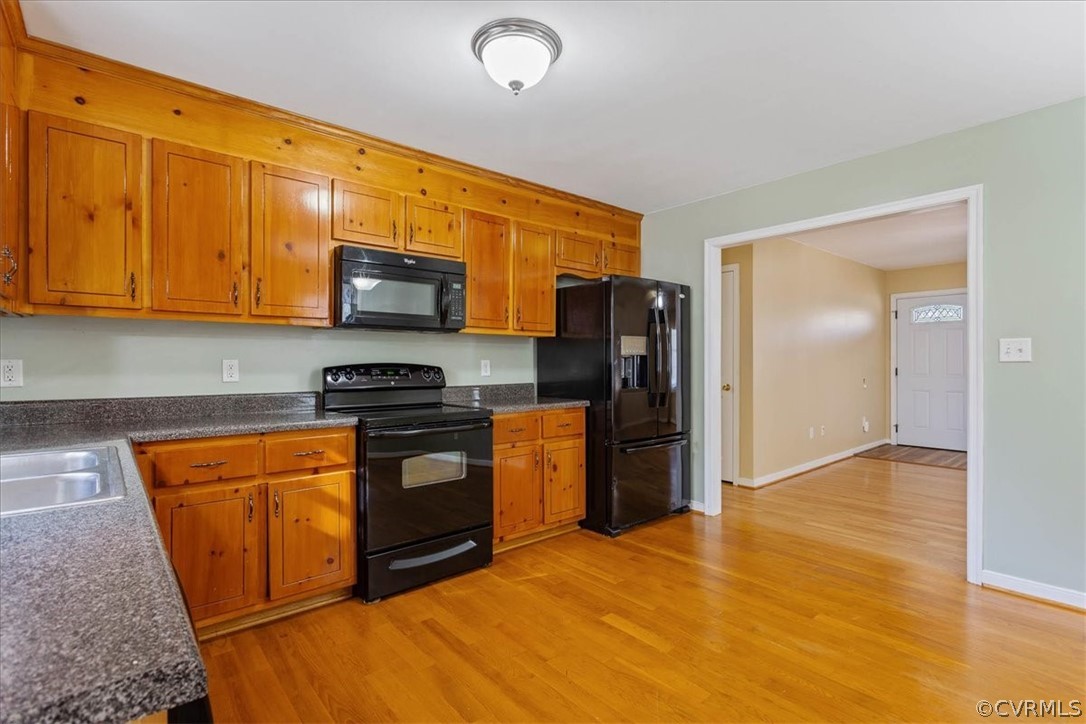 7231 Railroad Bed Road Carson, VA 23830 - Photo 11 of 42 a kitchen with stainless steel appliances granite countertop a refrigerator stove and sink
