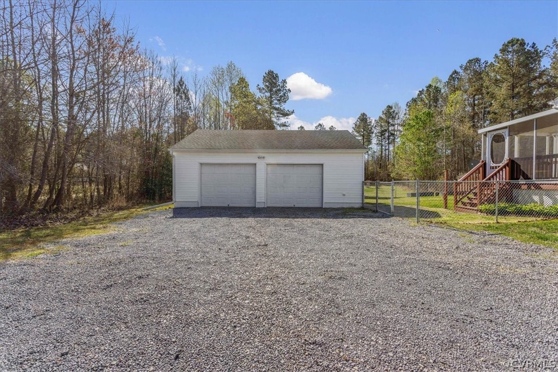 7231 Railroad Bed Road Carson, VA 23830 - Photo 23 of 42 a front view of a house with a yard and garage