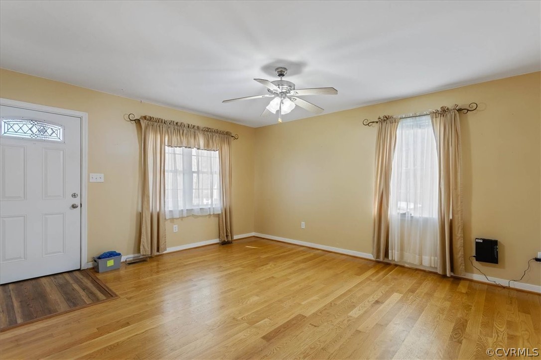 7231 Railroad Bed Road Carson, VA 23830 - Photo 6 of 42 an empty room with wooden floor and windows