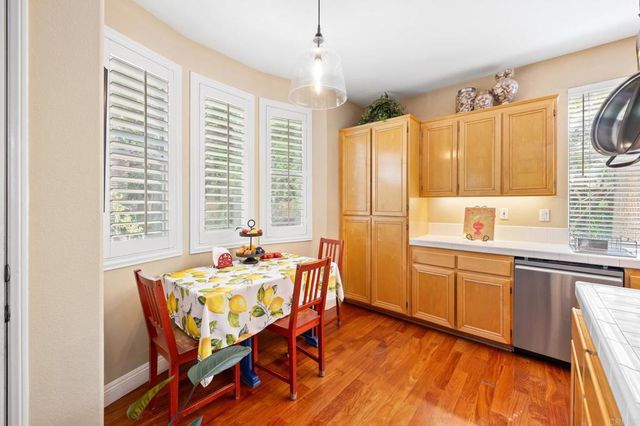 a dining room with a sink table and chairs