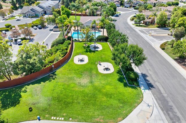 an aerial view of a houses with outdoor space