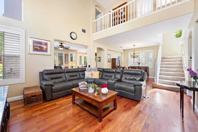 a living room with furniture or couch and a wooden floor
