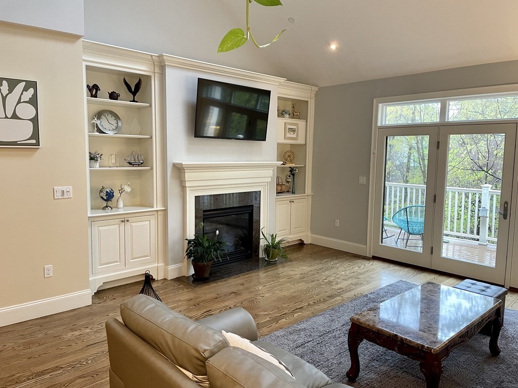 8 Graystone Circle Winchester, MA 01890 - Photo 11 of 41 a living room with furniture fireplace and flat screen tv