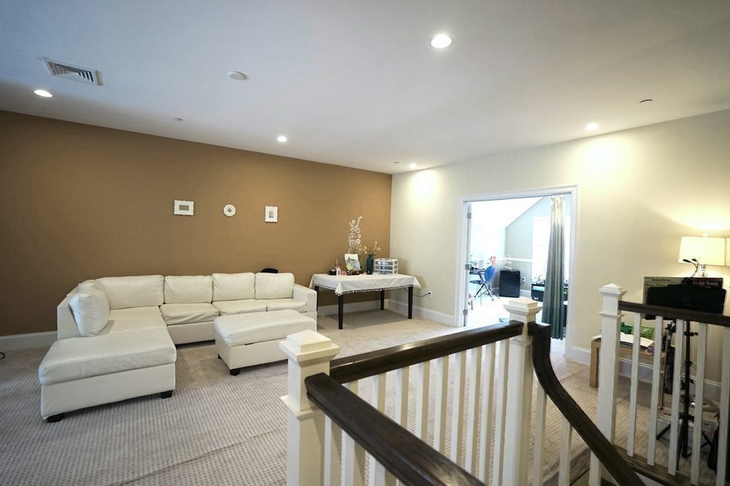 8 Graystone Circle Winchester, MA 01890 - Photo 25 of 41 a living room with furniture and a flat screen tv
