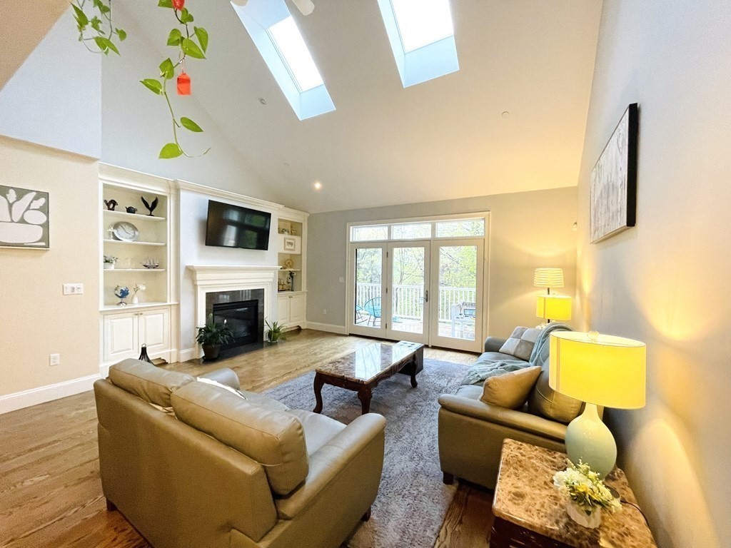 8 Graystone Circle Winchester, MA 01890 - Photo 9 of 41 a living room with furniture fireplace and a flat screen tv