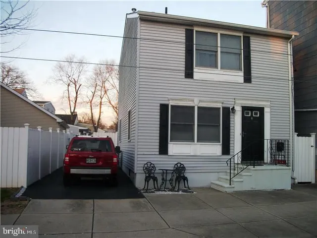 a car parked in front of a house