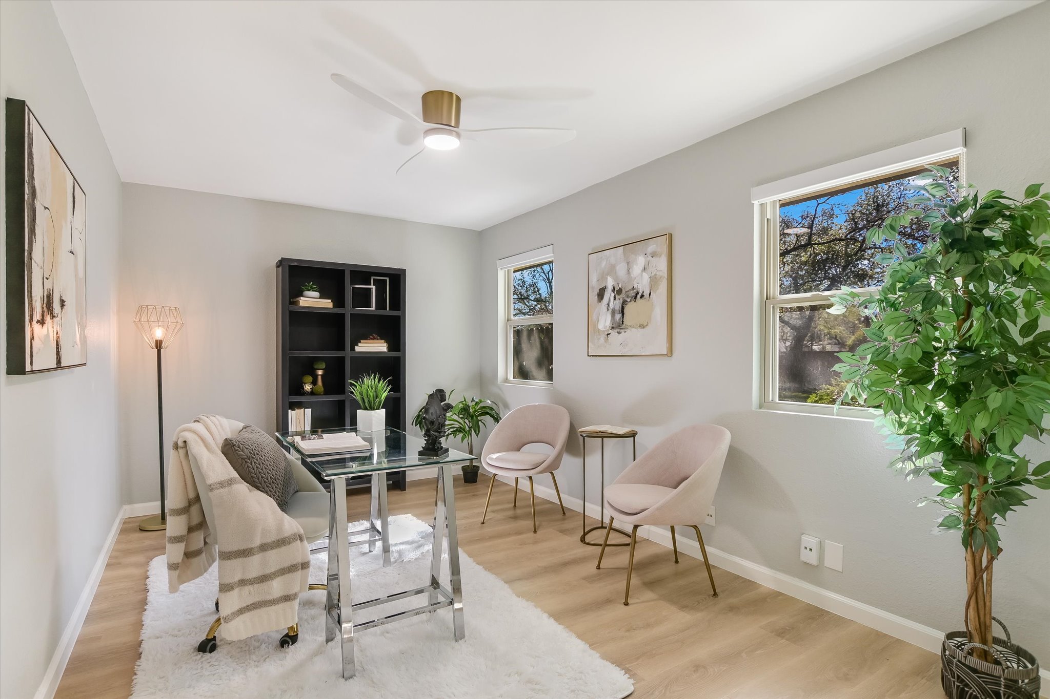 9905 Richelieu Road Austin, TX 78750 - Photo 11 of 32 Living area featuring a desk, light wood-style laminate flooring, and a ceiling fan