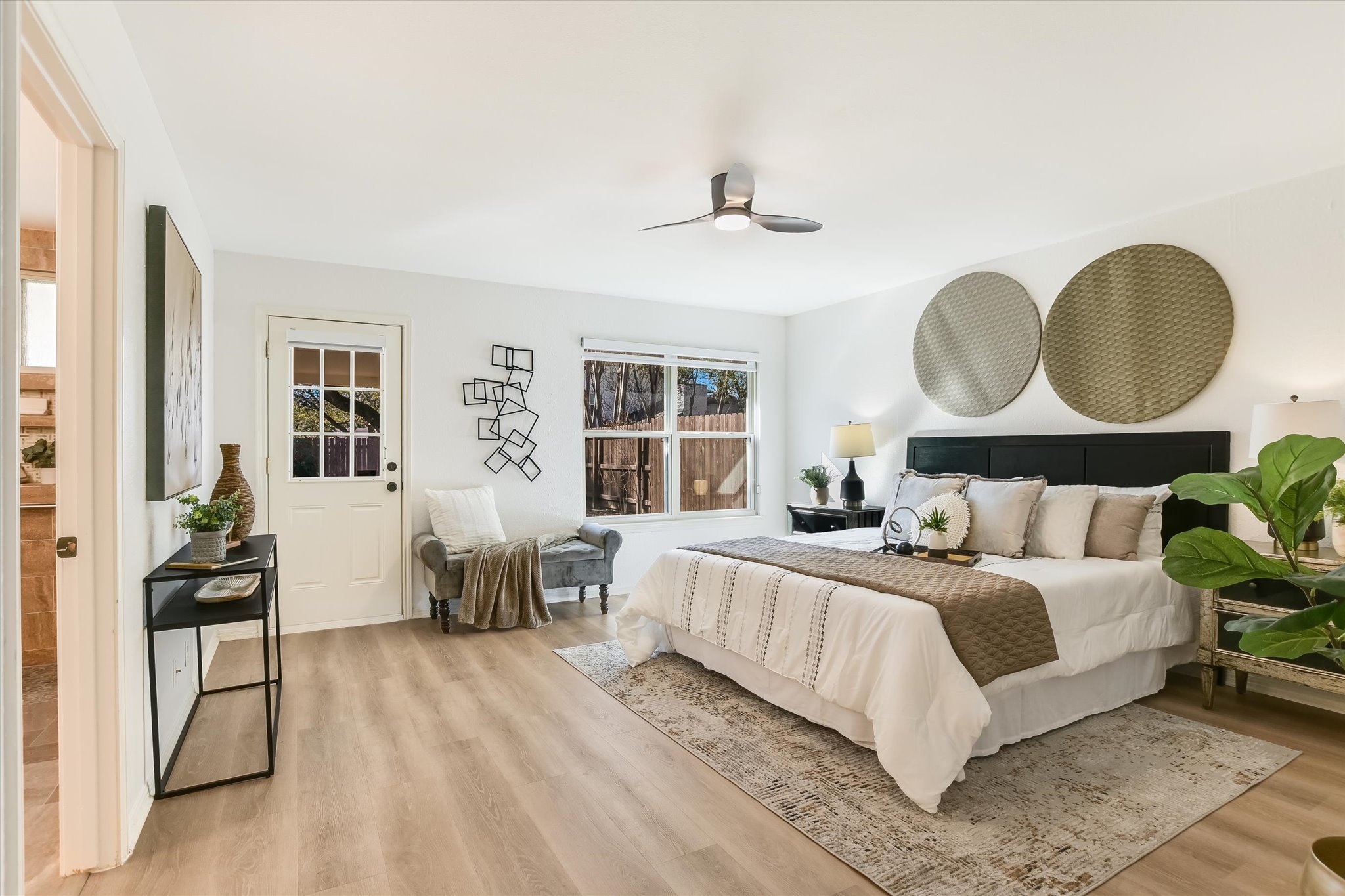 9905 Richelieu Road Austin, TX 78750 - Photo 12 of 32 Bedroom featuring light wood-style laminate floors and ceiling fan