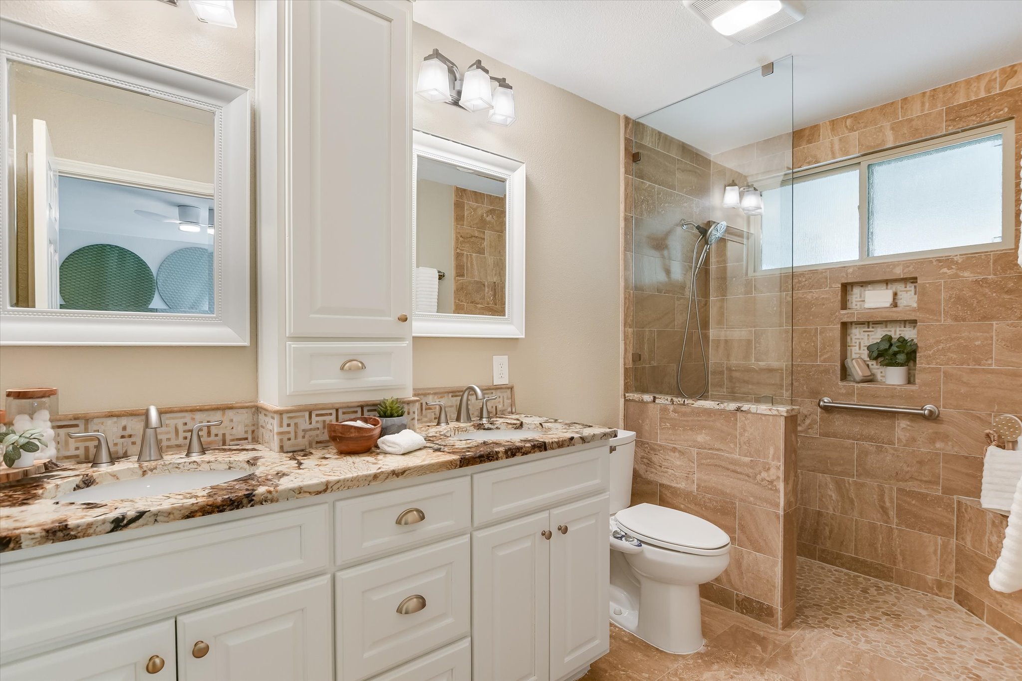 9905 Richelieu Road Austin, TX 78750 - Photo 13 of 32 Full bath with double vanity and a walk in shower