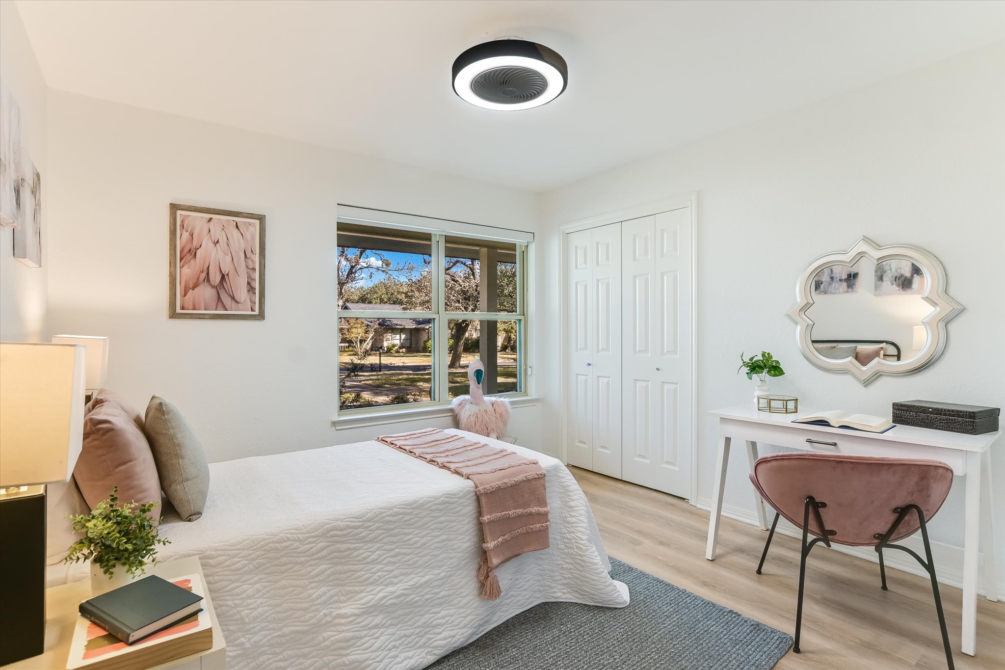 9905 Richelieu Road Austin, TX 78750 - Photo 16 of 32 Bedroom featuring light wood-look laminate flooring and a closet