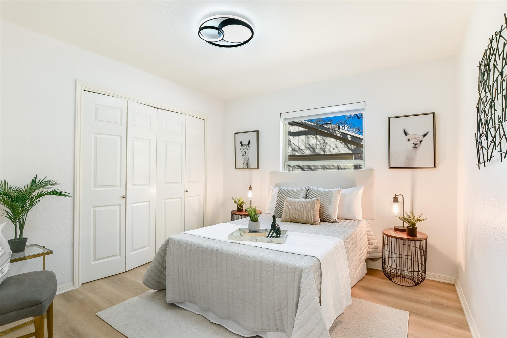 9905 Richelieu Road Austin, TX 78750 - Photo 17 of 32 Bedroom featuring wood style laminate floors and a closet