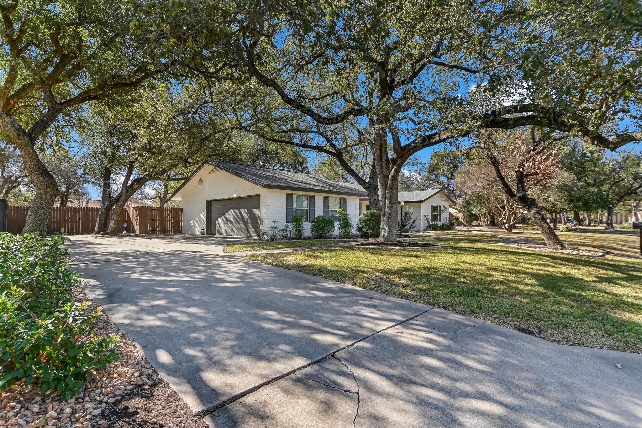9905 Richelieu Road Austin, TX 78750 - Photo 23 of 32 Ranch-style home with concrete driveway and an attached garage