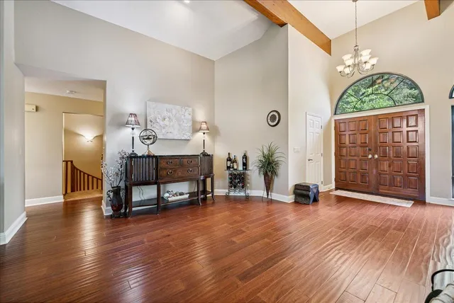 a bedroom with a balcony a bed and a couch