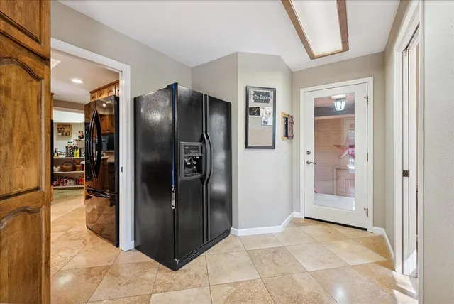 a kitchen with stainless steel appliances kitchen island granite countertop a sink and cabinets