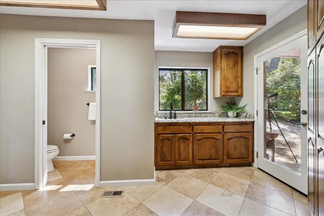 a dining room with furniture and a chandelier