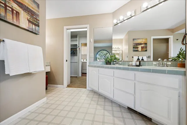 a view of a backyard with wooden fence and large trees