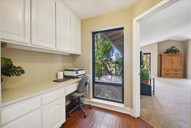 a view of a patio with table and chairs and potted plants