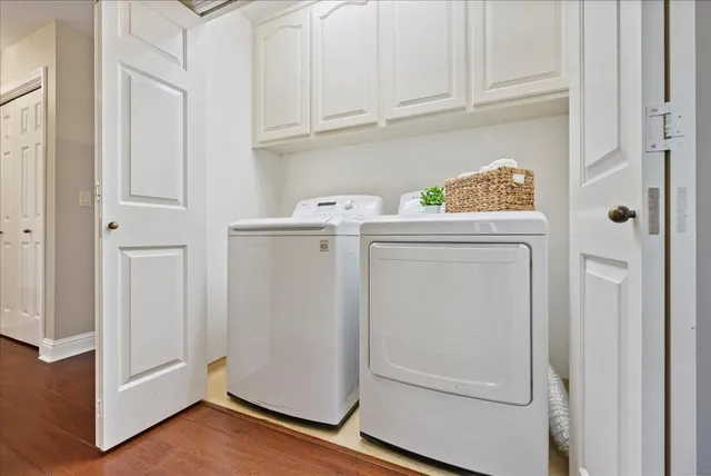 a living room with patio furniture and a potted plants