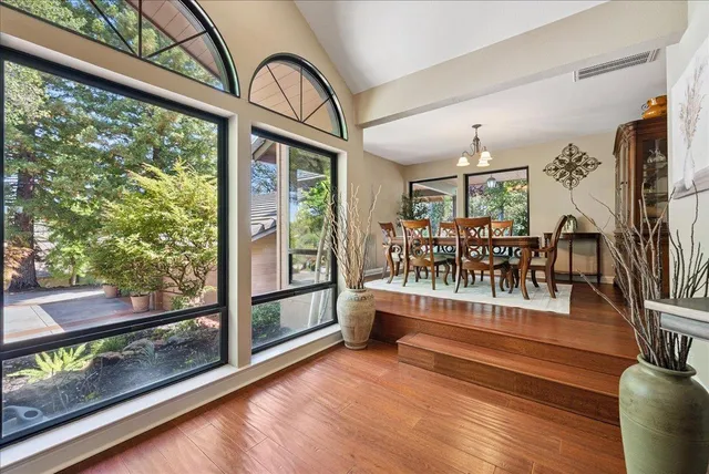 a living room with fireplace furniture and a fireplace