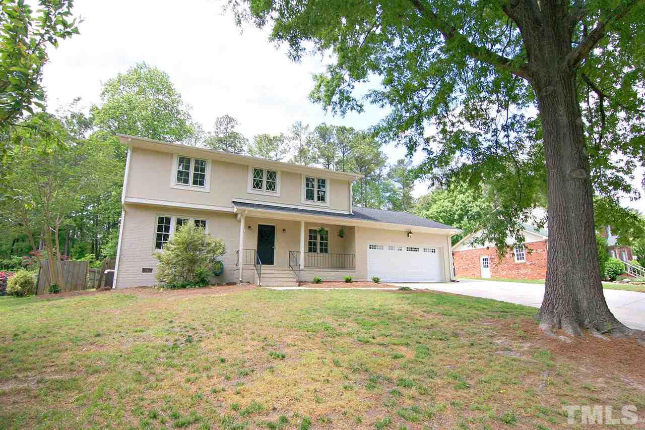 7801 Audubon Drive Raleigh, NC 27615 - Photo 2 of 25 a front view of a house with a yard