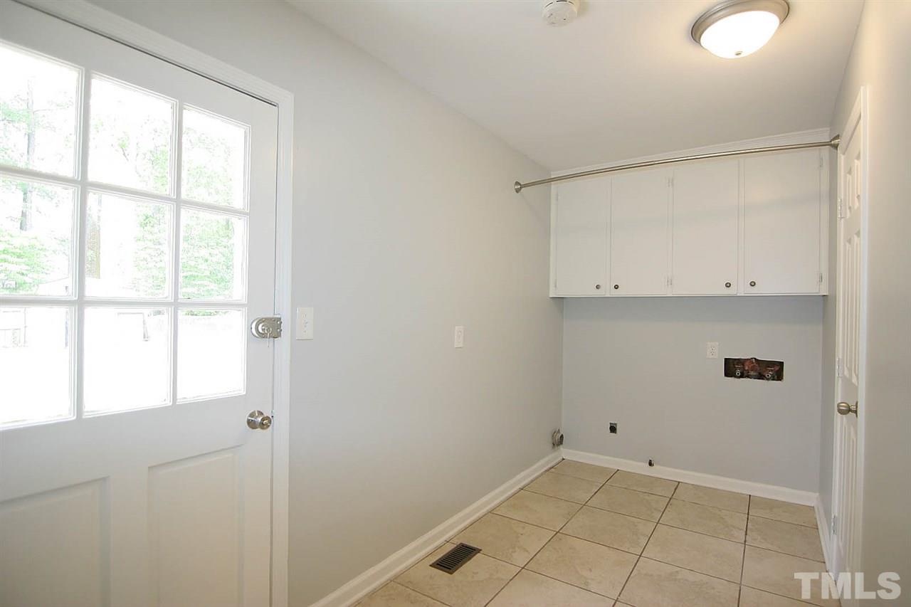 7801 Audubon Drive Raleigh, NC 27615 - Photo 14 of 25 a view of an empty room with a window