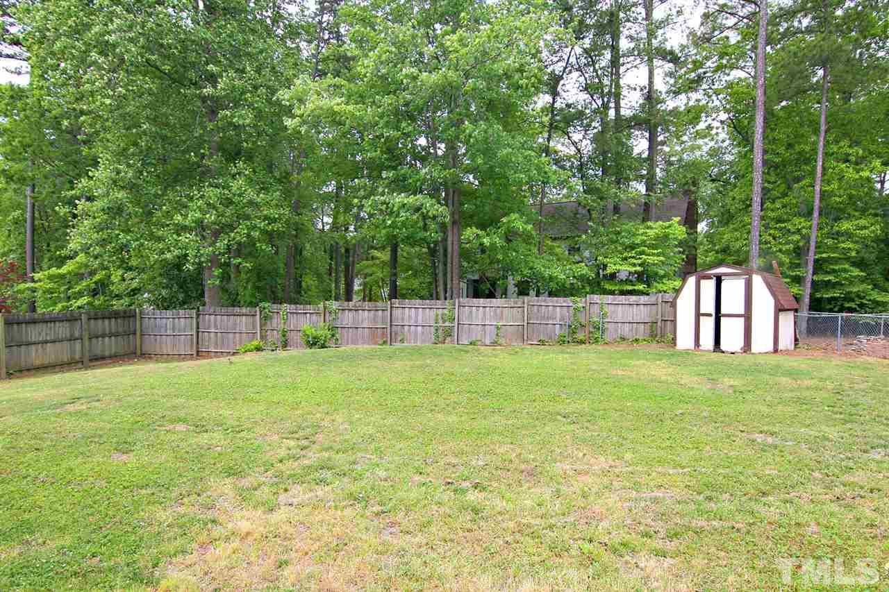 7801 Audubon Drive Raleigh, NC 27615 - Photo 3 of 25 a house view with a play ground in front of it