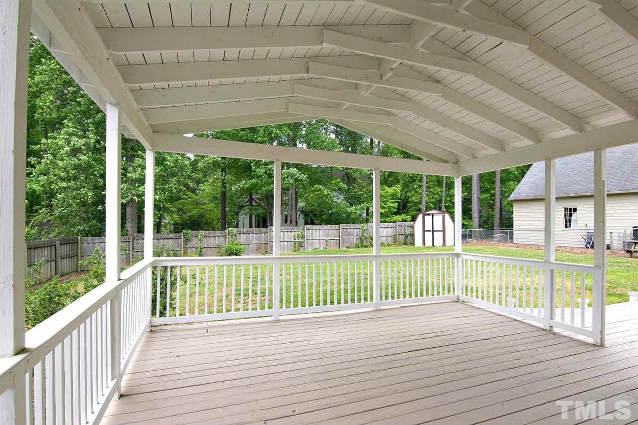 7801 Audubon Drive Raleigh, NC 27615 - Photo 24 of 25 a view of a deck with a big yard