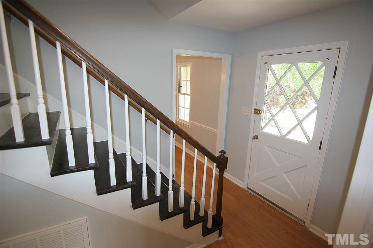 7801 Audubon Drive Raleigh, NC 27615 - Photo 4 of 25 a view of staircase with lots of windows